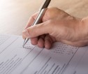 Person filling in questionnaire 